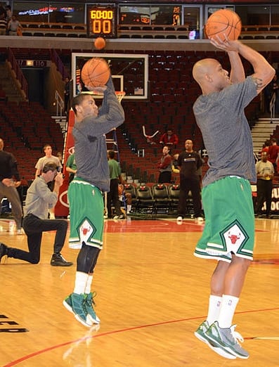 Derrick Rose (left) and Keith Bogans work on their shots.